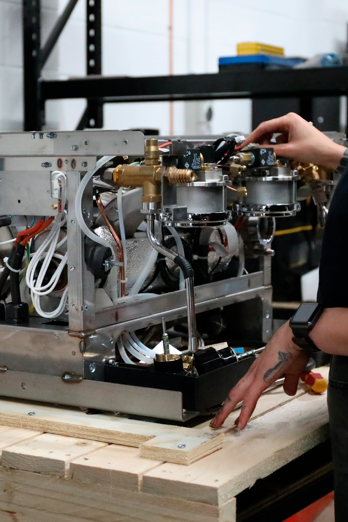 coffee technician repairs the internal workings of a coffee machine